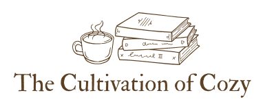 cup of steaming coffee beside a pile of books underneath text reads The Cultivation of Cozy